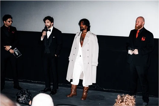 Cast and director taking questions on stage